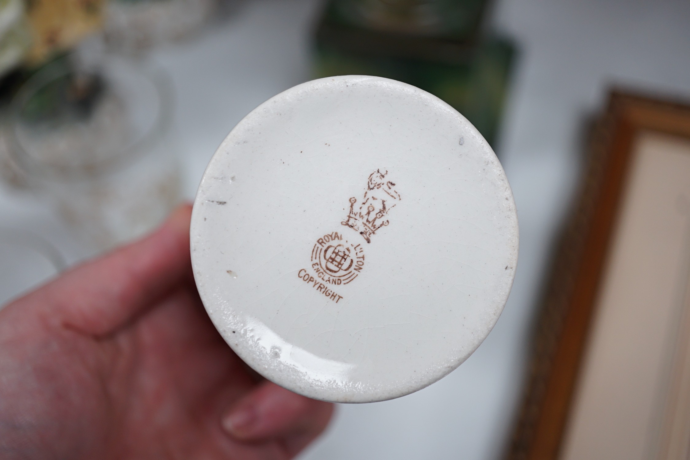 A group of porcelain figures, Doulton royal commemoratives, a Goebel Art Deco powder bowl and pin dollies etc (19)